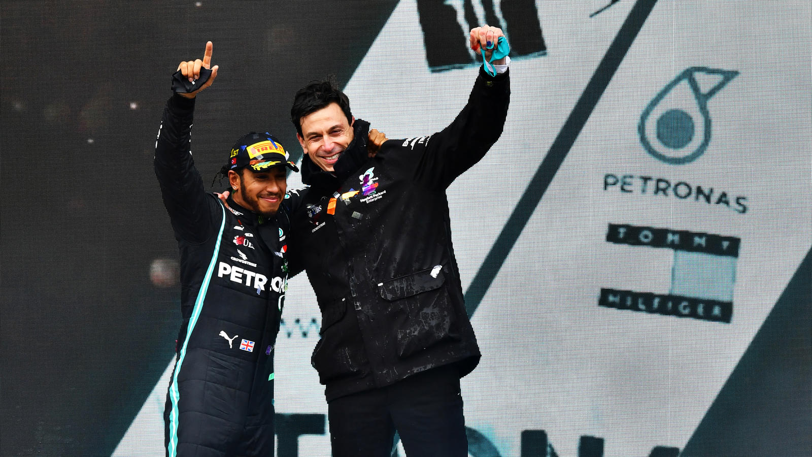 "Toto, ich bleibe weiter bei euch" ISTANBUL, TURKEY - NOVEMBER 15: Race winner Lewis Hamilton of Great Britain and Mercedes GP celebrates winning a 7th F1 World Drivers Championship with Mercedes GP Executive Director Toto Wolff on the podium during the F1 Grand Prix of Turkey at Inte