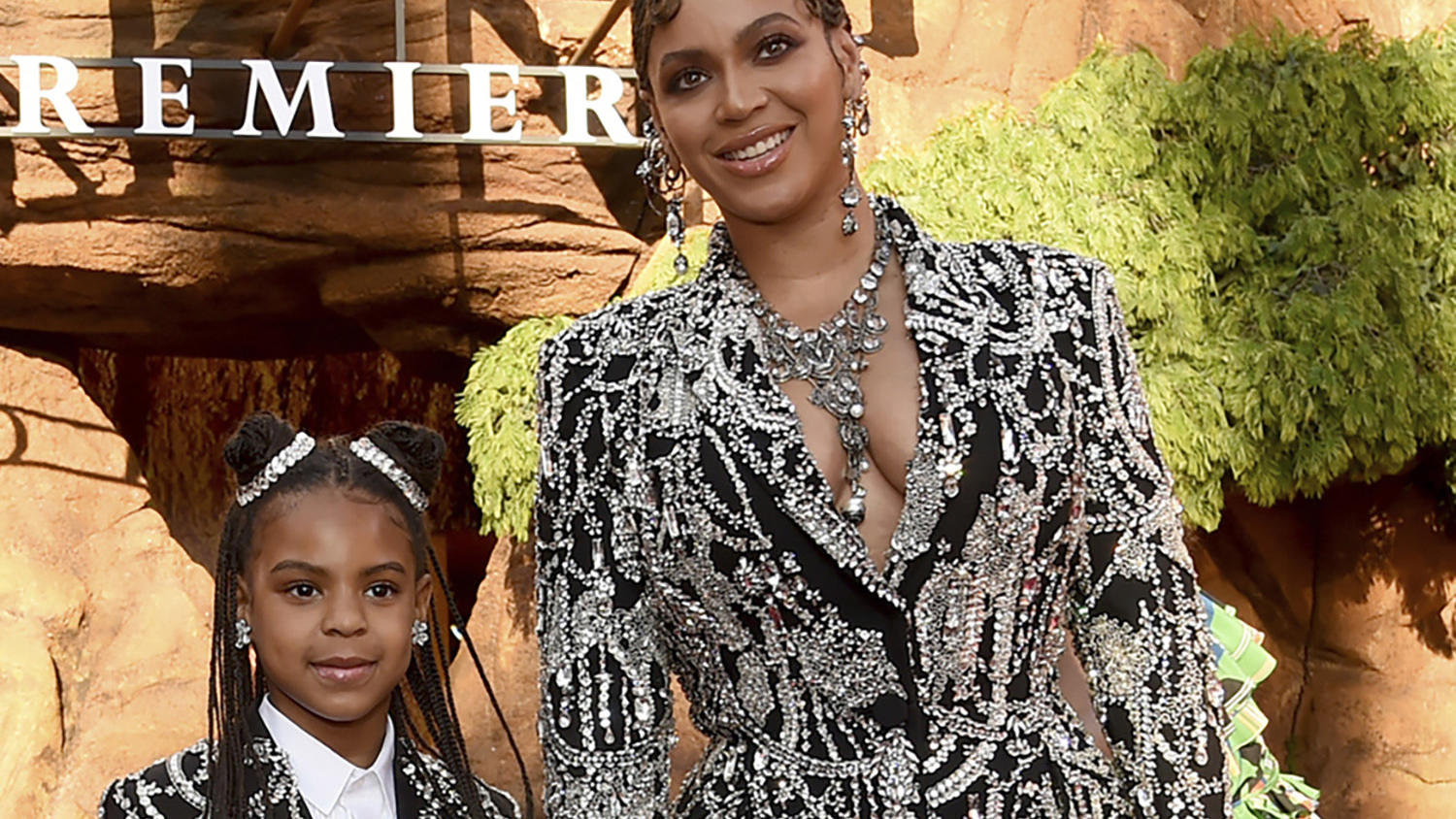 FILE - Beyonce, right, and her daughter Blue Ivy Carter arrive at the world premiere of "The Lion King" in Los Angeles on July 9, 2019. Blue Ivy's name was added to the nominee list for best music video for her mother's "Brown Skin Girl." (Photo by C