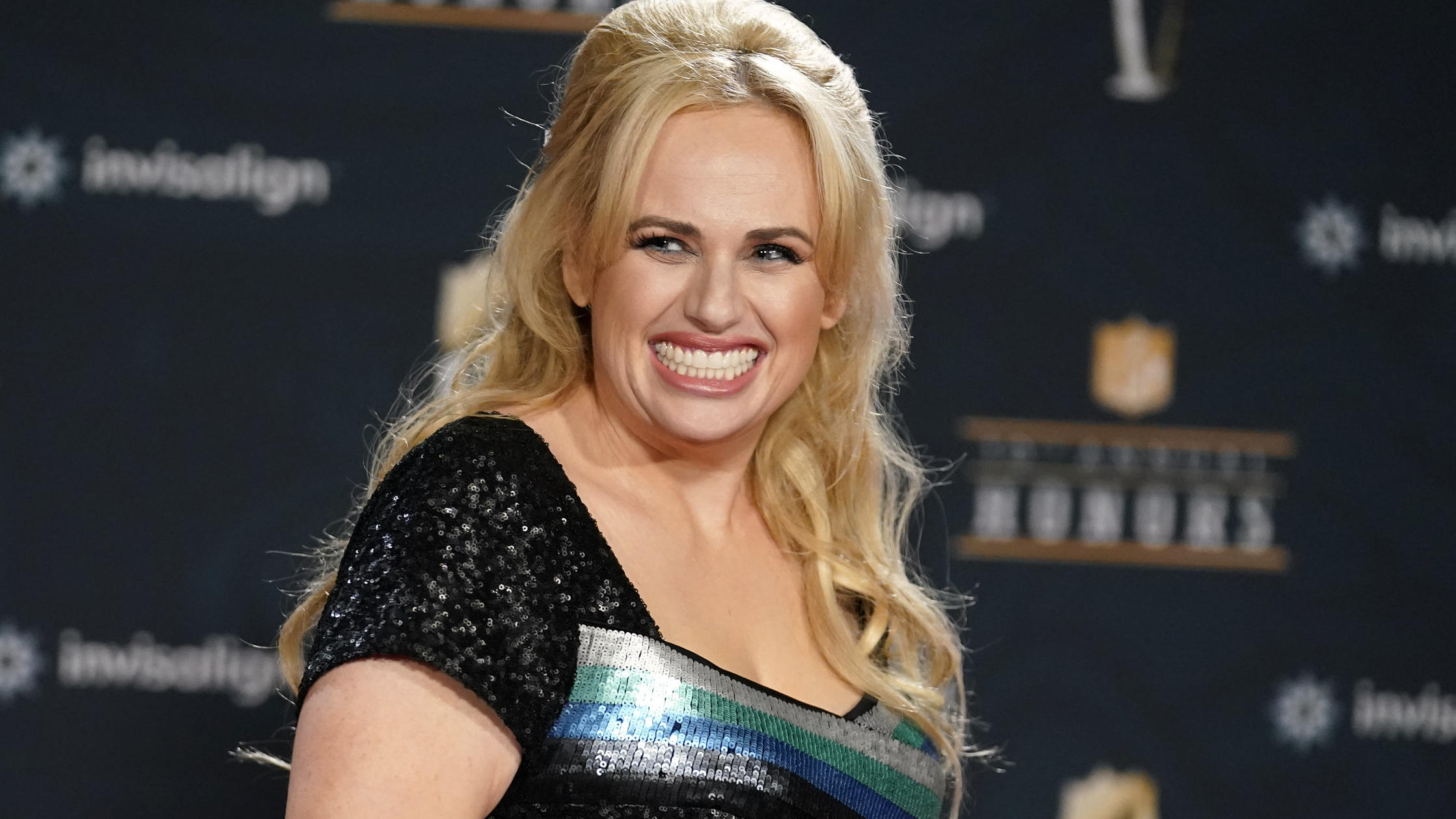 FILE - In this Tuesday, Feb. 2, 2021, file photo, Rebel Wilson poses on the red carpet during the NFL Honors football awards show, in Los Angeles. Wilson returns to her roots as host of ABC's â€œPooch Perfect,â€ an eight-episode series featuring 10 