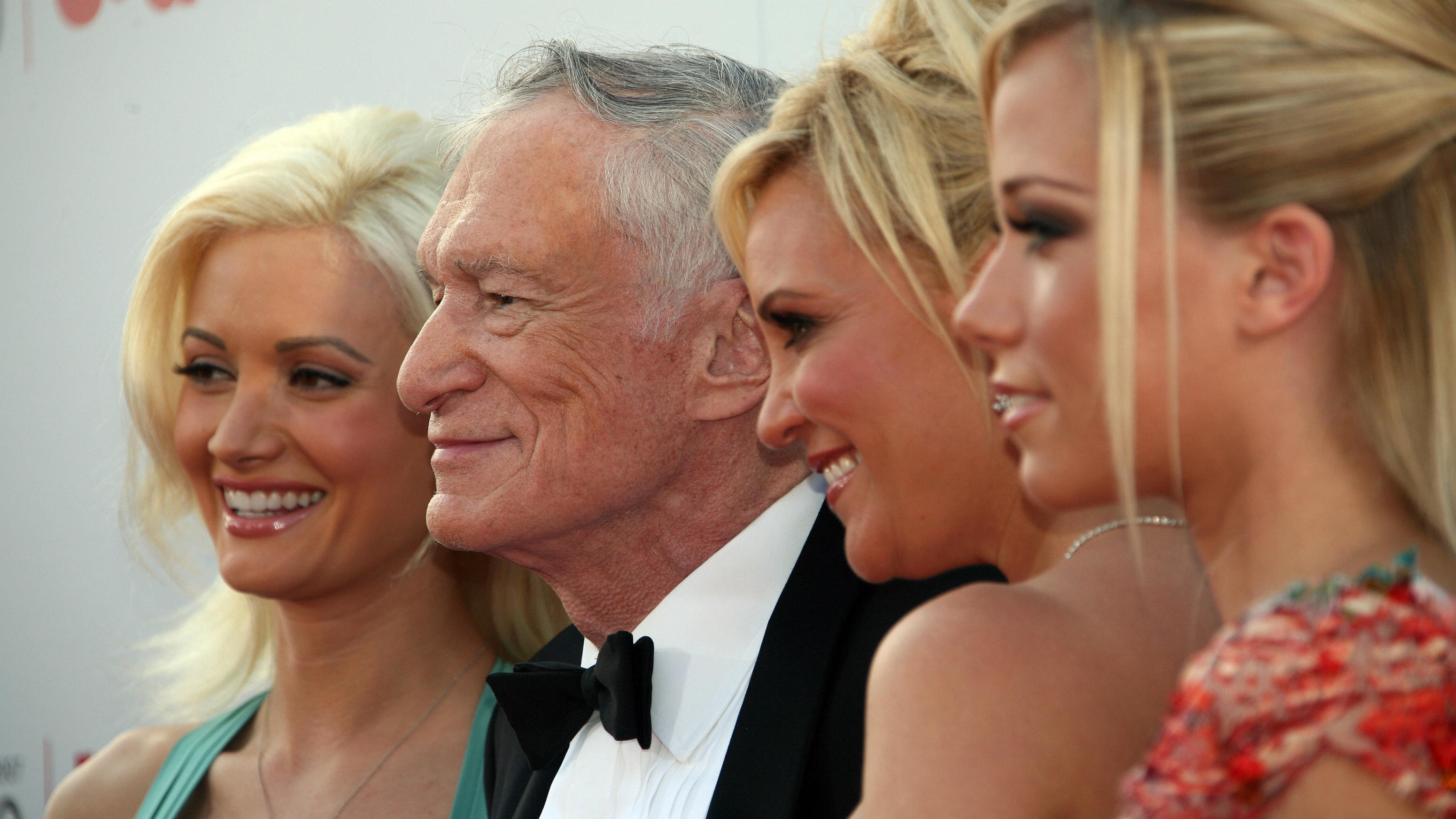Hollywood, UNITED STATES: (L-R) Playmate Holly Madison, Playboy Magazine creator Hugh M. Hefner, Playmate Bridget Marquardt and Playmate Kendra Wilkinson arrive to the 35th AFI Life Achievement Award tribute to Al Pacino held at the Kodak Theatre on 