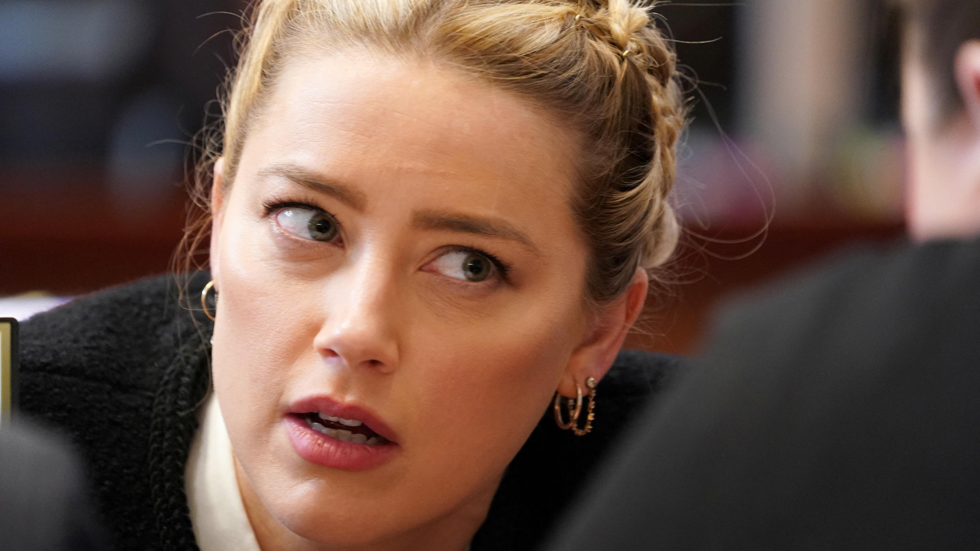 US actor Amber Heard speaks with a member of her legal team as she arrives at the start of the day during the 50 million US dollar Depp vs Heard defamation trial against her at the Fairfax County Circuit Courthouse in Fairfax, Virginia, U.S., May 19,