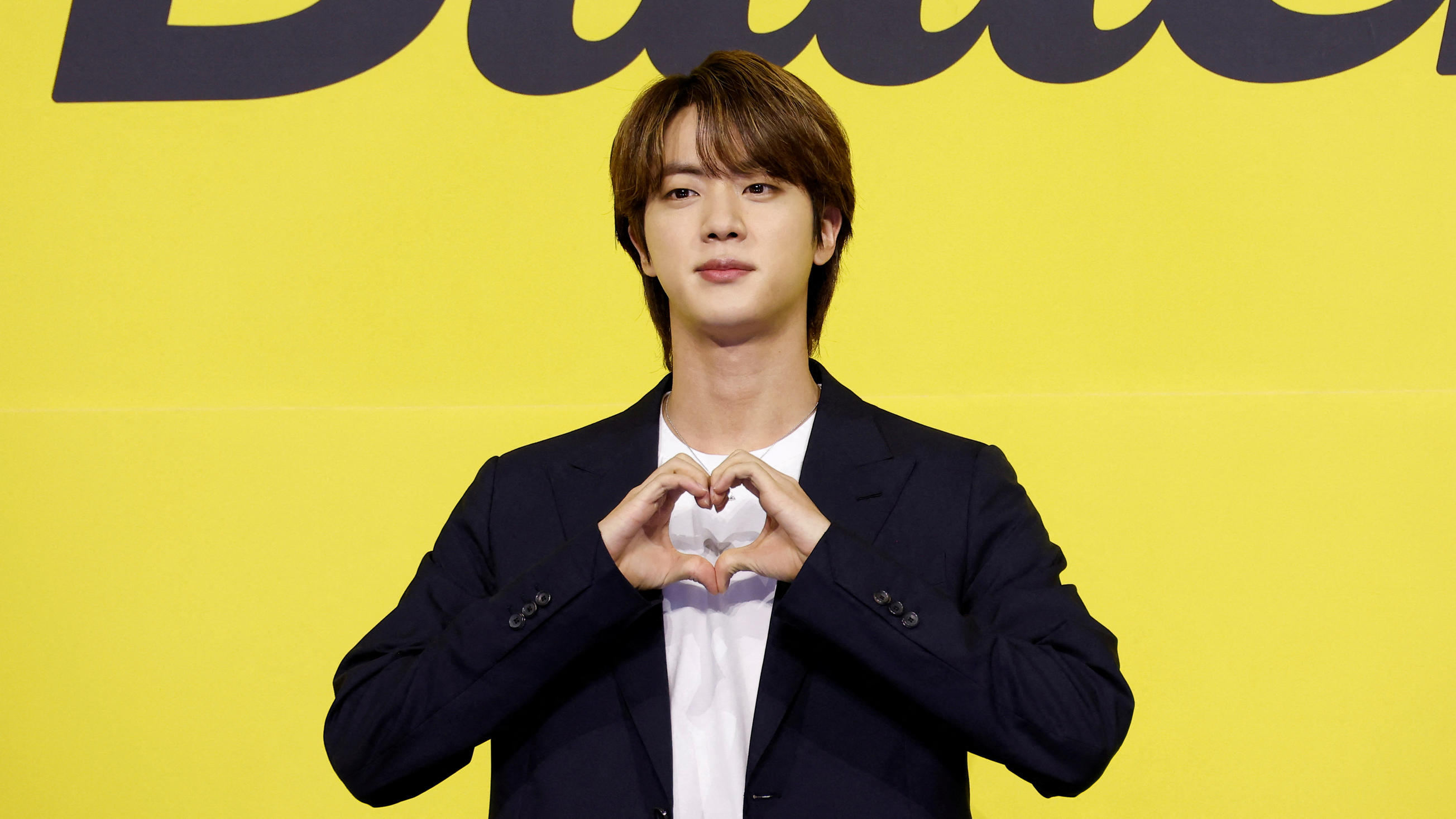 FILE PHOTO: K-pop boy band BTS member Jin poses for photographs during a photo opportunity promoting their  new single 'Butter' in Seoul, South Korea, May 21, 2021.   REUTERS/Kim Hong-Ji/File Photo