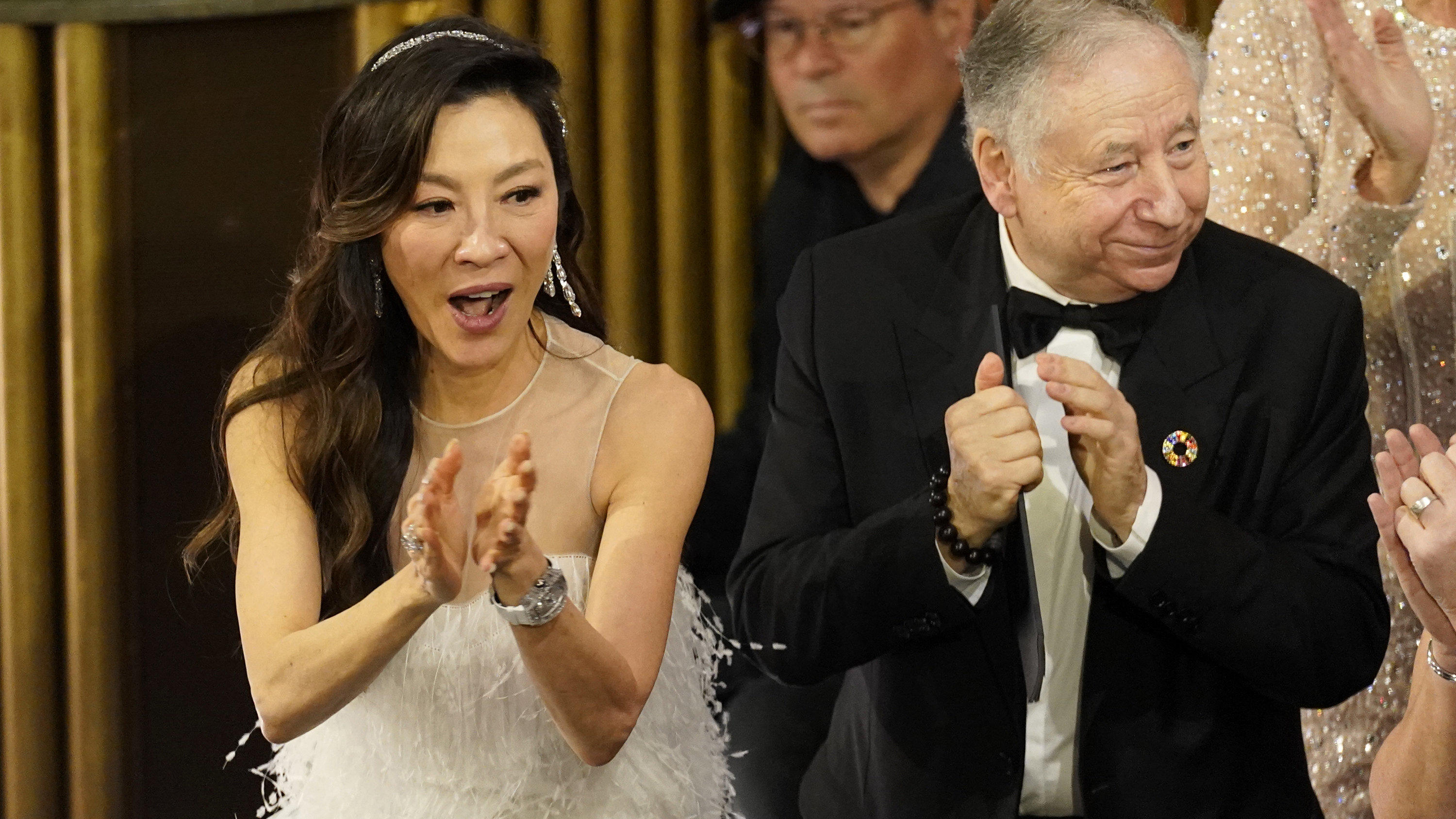Michelle Yeoh, left, and Jean Todt, cheer in the audience at the Oscars on Sunday, March 12, 2023, at the Dolby Theatre in Los Angeles. (AP Photo/Chris Pizzello)