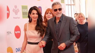 George und Amal Clooney händchenhaltend bei den...
