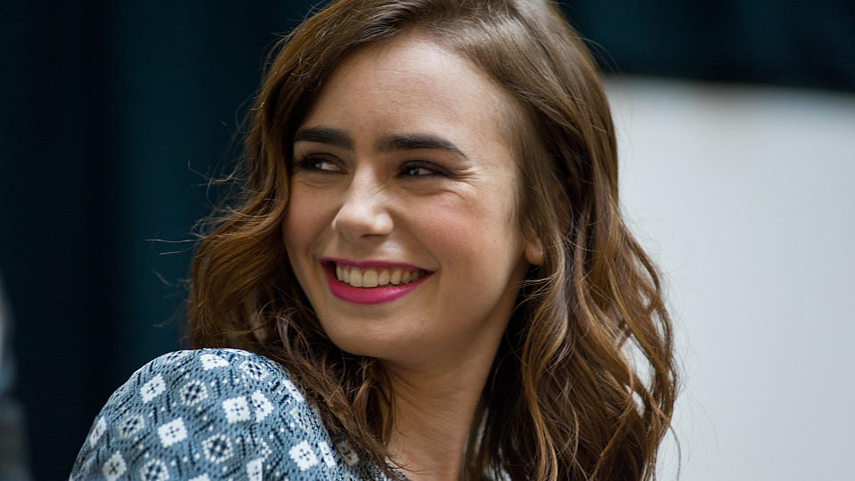 CHICAGO RIDGE, IL - JULY 30:  Lily Collins attends a Q&A and autograph session for fans in anticipation of Screen Gems' action-fantasy THE MORTAL INSTRUMENTS: CITY OF BONES at Chicago Ridge Mall on July 30, 2013 in Chicago Ridge, Illinois.  (Photo by